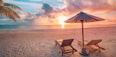 Amazing romantic beach. Chairs on the sandy beach near the sea. Summer holiday vacation concept for tourism. Tropical island landscape. Tranquil shore scenery, relax seaside horizon, palm leaves photo