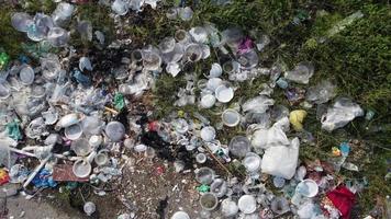 Aerial ascending look down rubbish plastic waste video