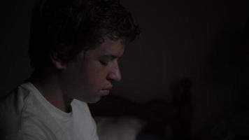 Sad, Depressed Young Teen Boy Sitting On His Bed video