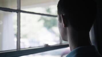 Sad, Depressed Teenager, Teen Boy Looking Outside Window video