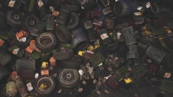 Discarded tires and containers in a daytime urban recycling area video